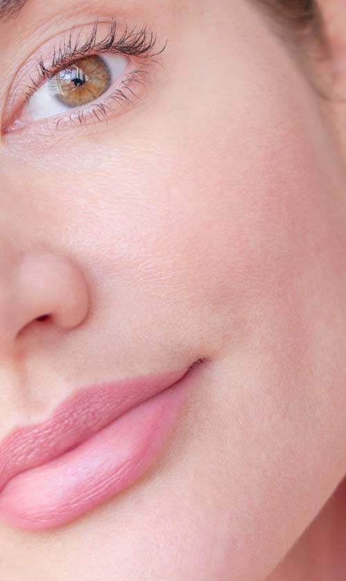 A close up of a woman with clear skin